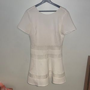 White dress. Size large. Worn but still in good shape.